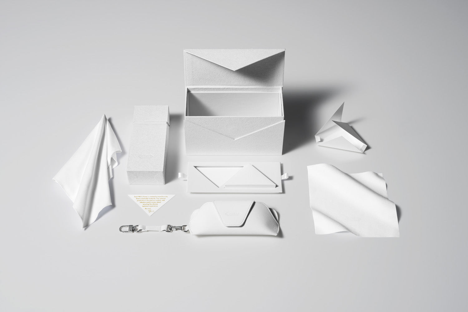 PRESS Matte White Collection: Collectors Box, Hard case, Soft Case, Care Card, Large and Small Cleaning Cloth.